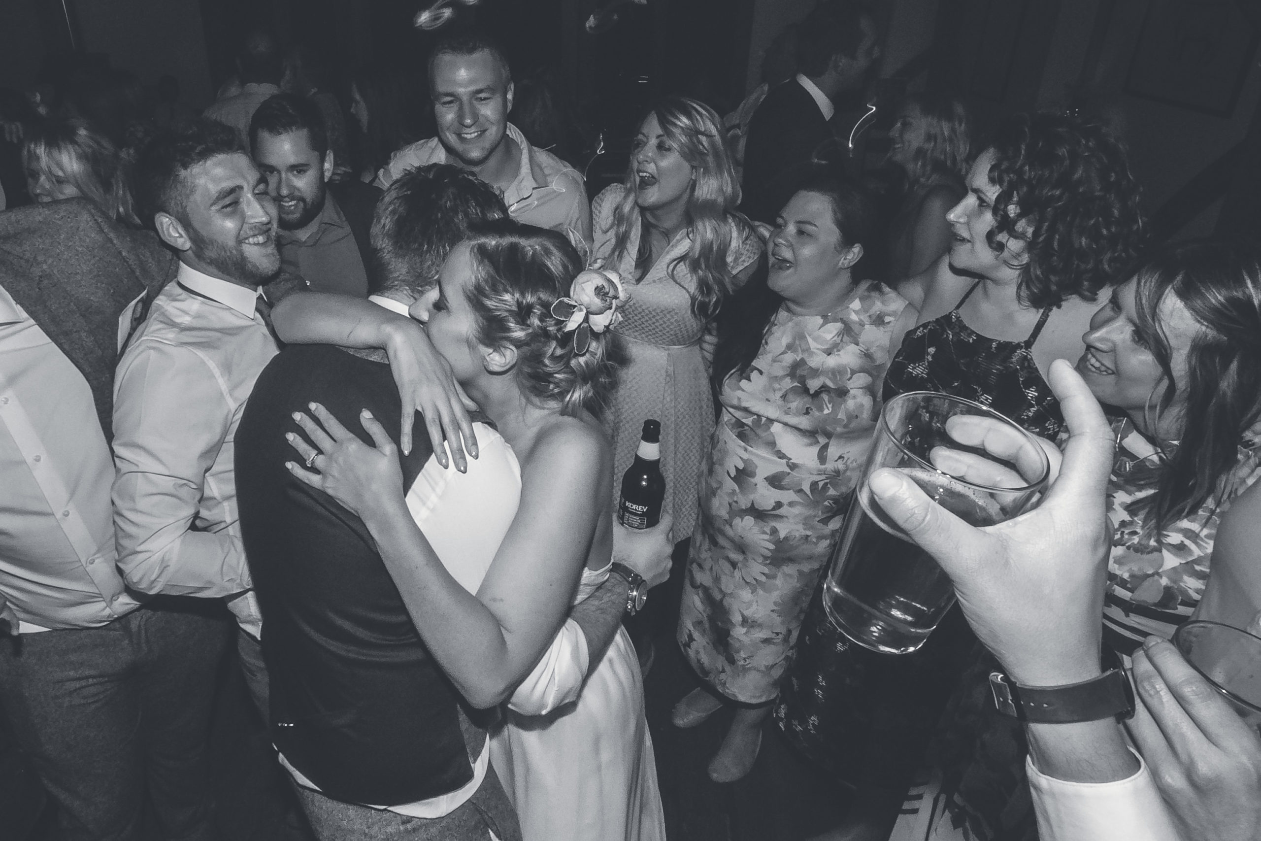 Bride and groom hugs at the end of their wedding