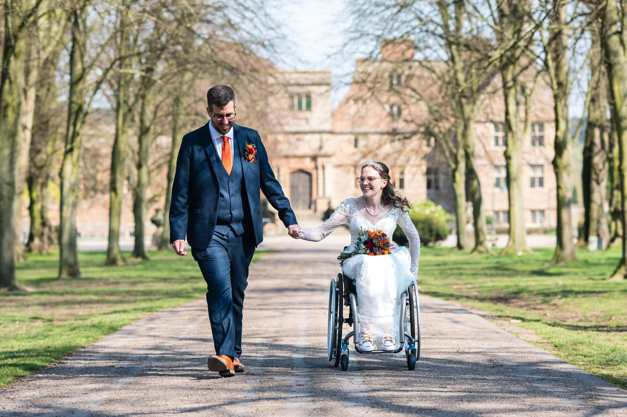 Bride in a wheelchair with husband at Rufford Mill