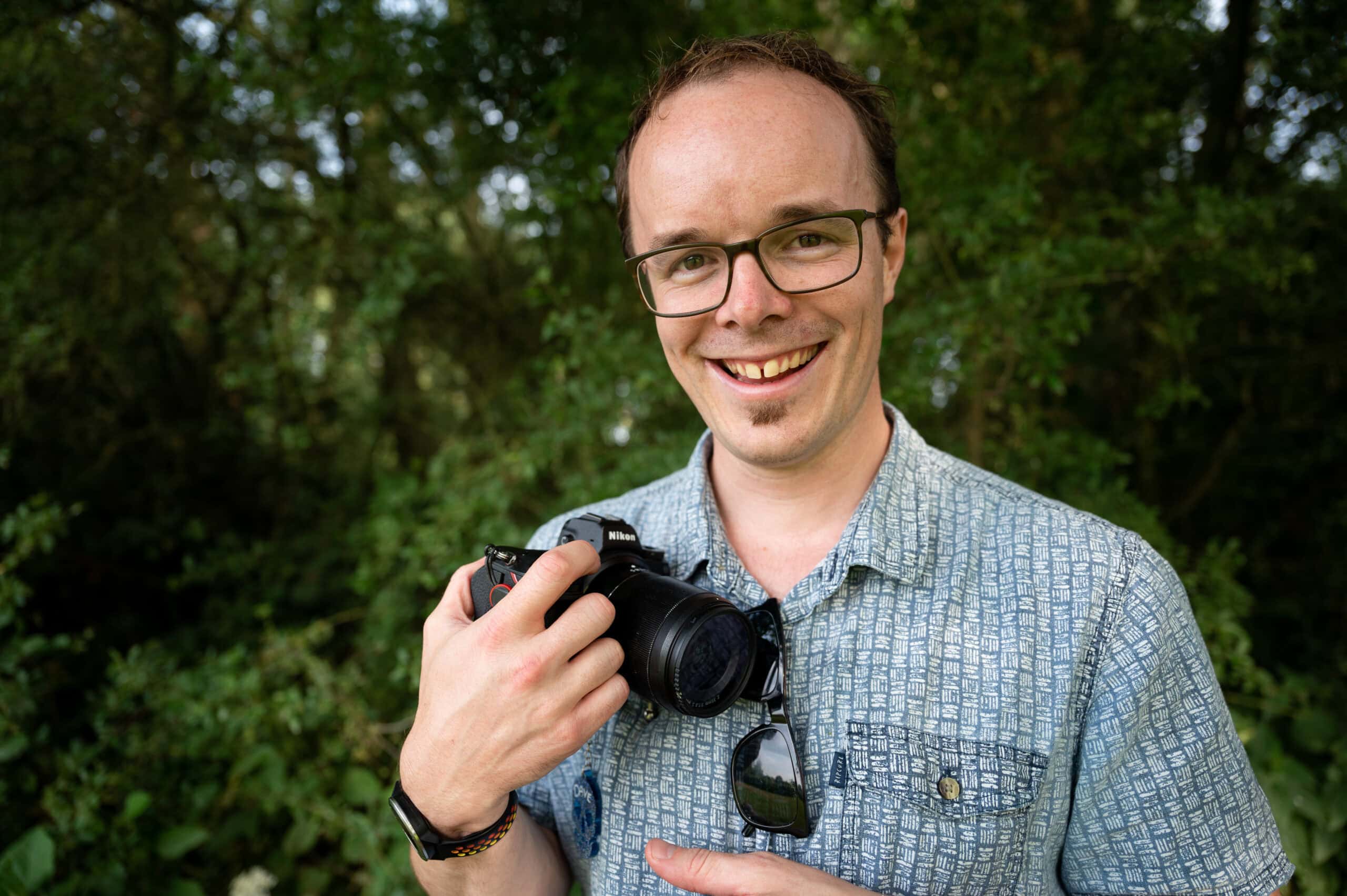 Dave Fuller, Nottingham wedding photographer, smiling with his camera