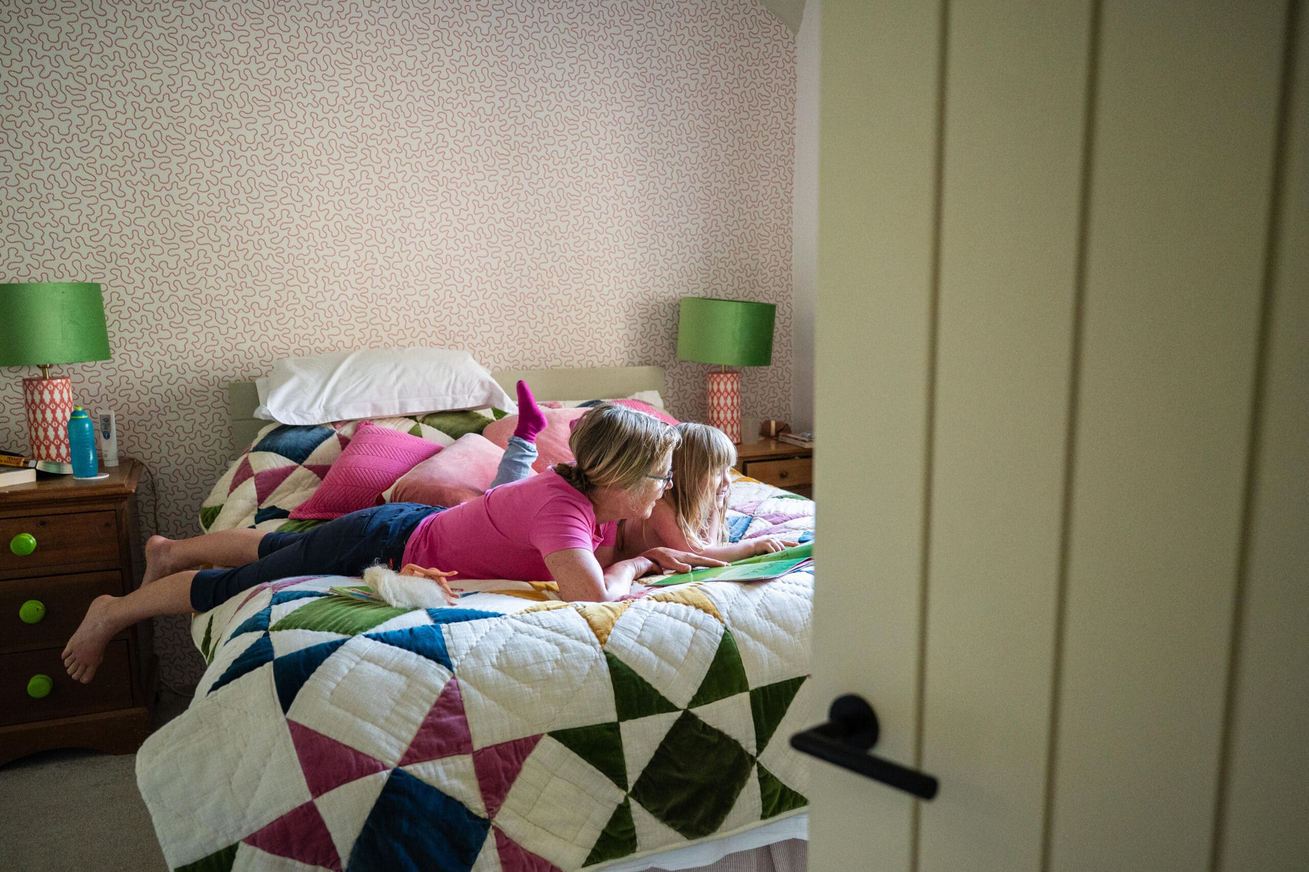 Children play on the bed in their bedroom