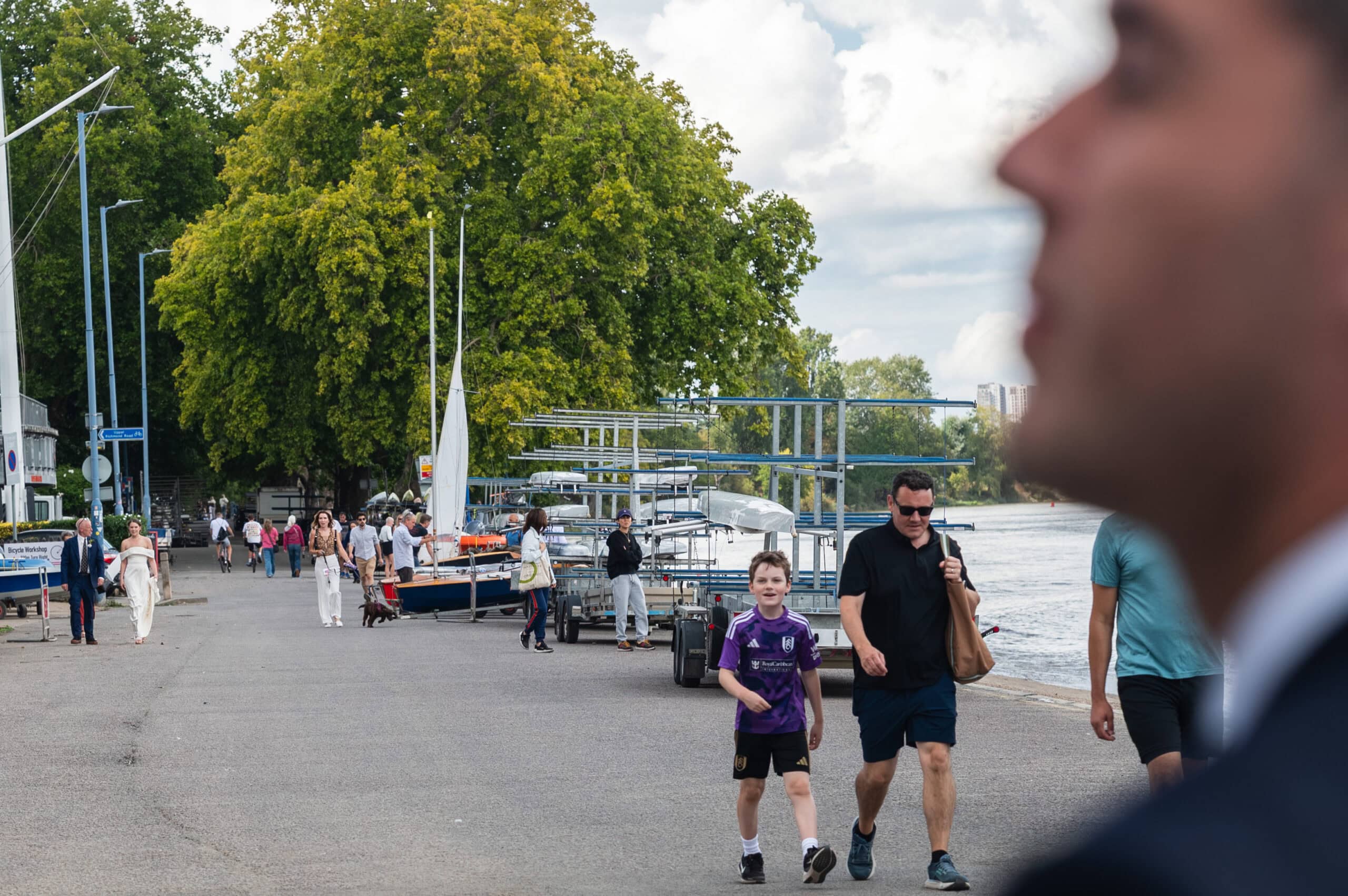 Wedding guests outside London Rowing Club on Putney Embankment beside the Thames
