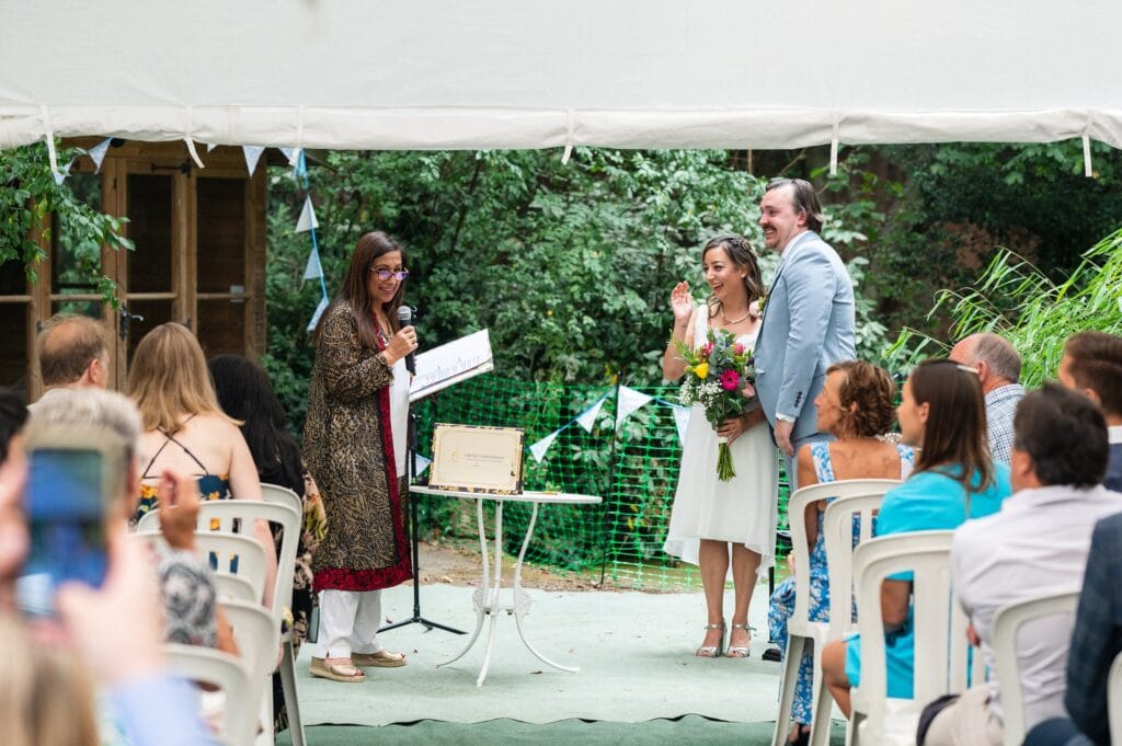 Celebrant wedding ceremony under a gazebo in Sabrina and Tim's garden in Beeston, Nottingham