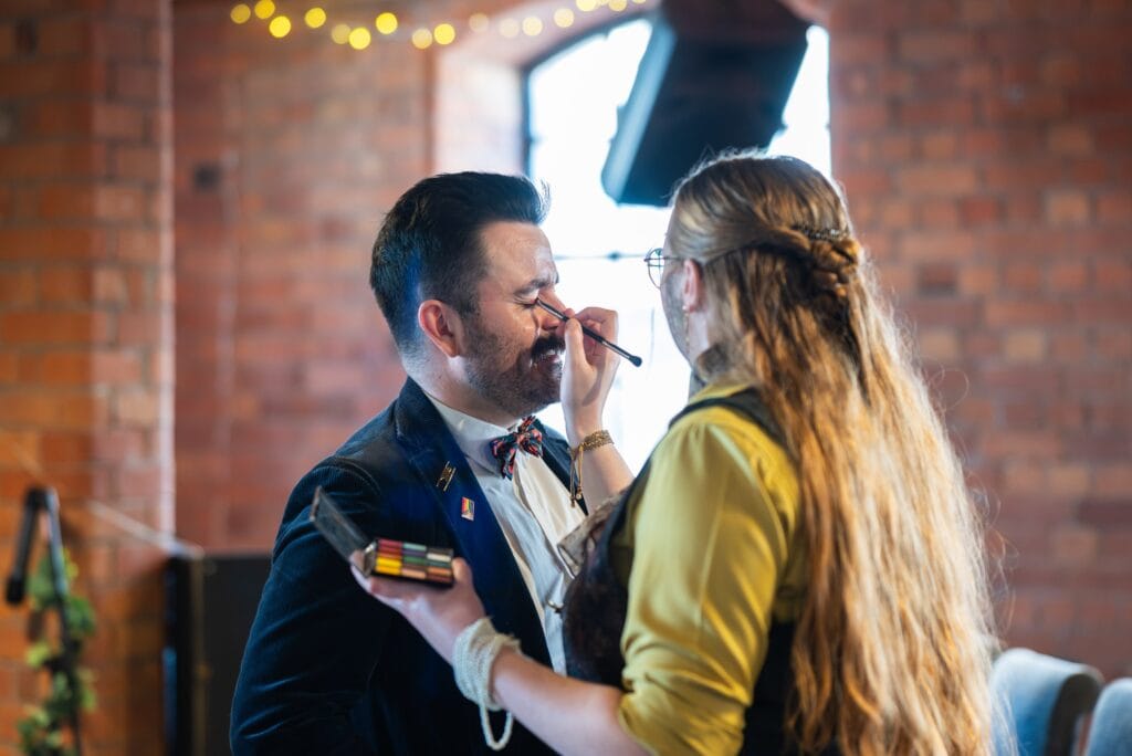 Celebrant from Tying the Knot Ceremonies having his make-up done before a wedding
